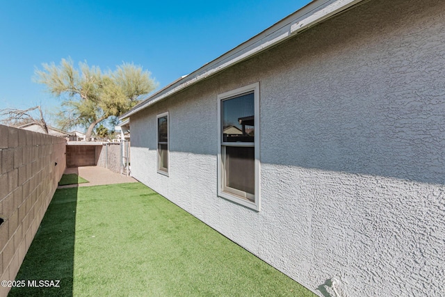 view of home's exterior featuring a lawn