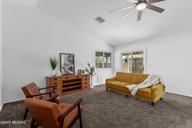 carpeted living room featuring ceiling fan and lofted ceiling