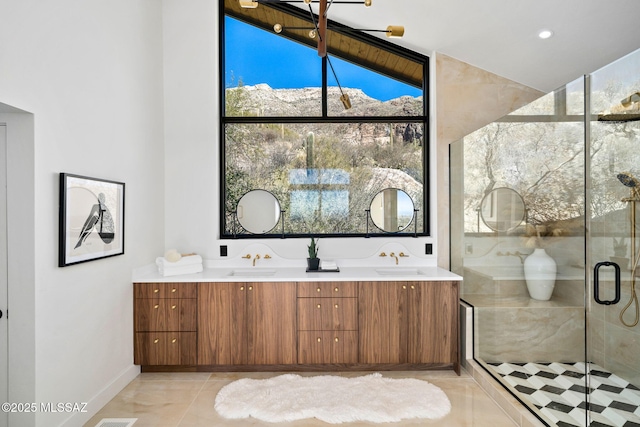 bathroom featuring an enclosed shower, a mountain view, vanity, and tile patterned floors