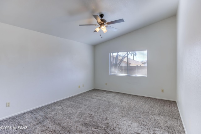 spare room featuring ceiling fan, carpet flooring, and lofted ceiling