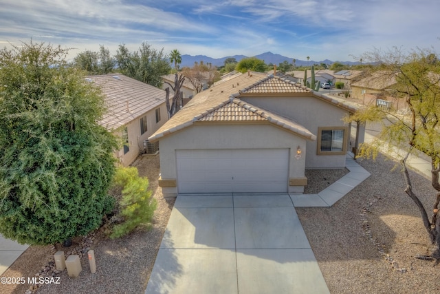 view of front of home featuring a mountain view and a garage