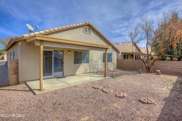 rear view of house with a patio area