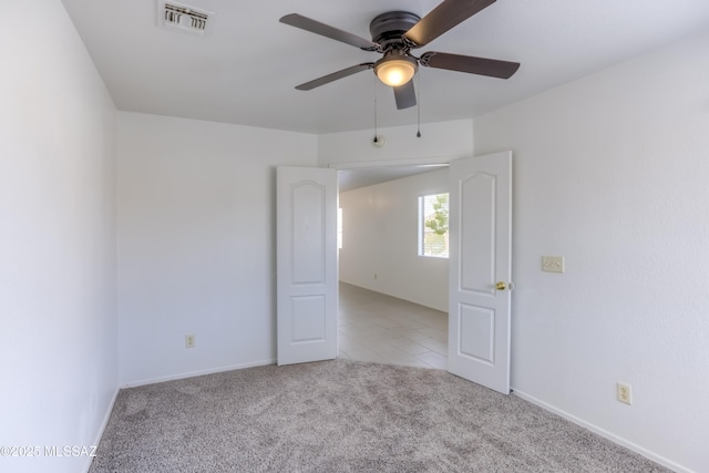 carpeted empty room with ceiling fan