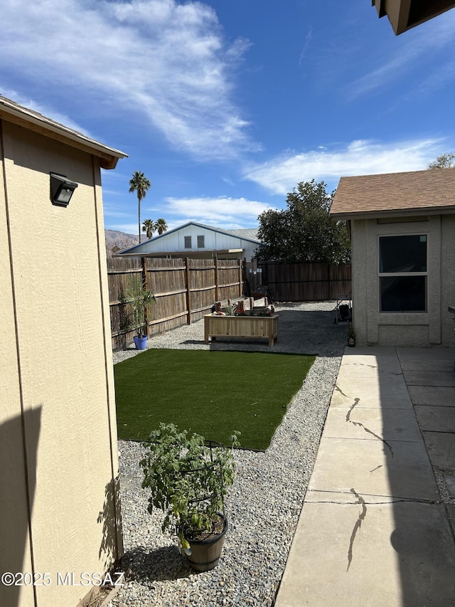 view of yard featuring a fenced backyard and a patio