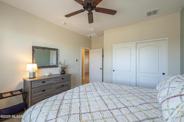 bedroom with ceiling fan and a closet