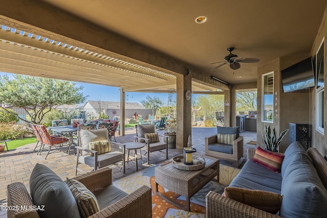 view of patio with a pergola, outdoor lounge area, and ceiling fan