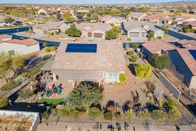 birds eye view of property with a residential view