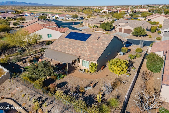 birds eye view of property with a mountain view