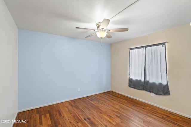 spare room featuring hardwood / wood-style flooring and ceiling fan