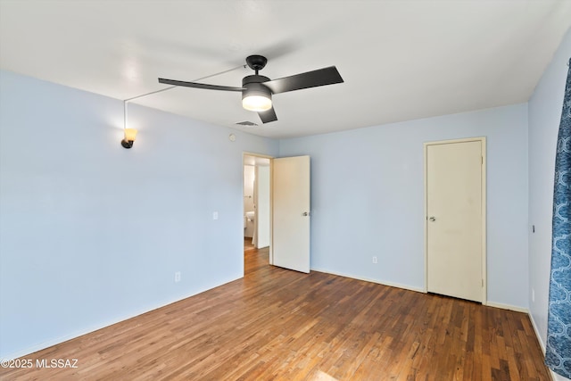 unfurnished bedroom featuring wood-type flooring and ceiling fan