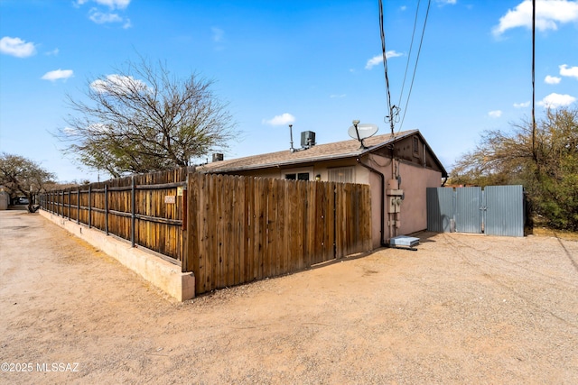 view of property exterior with central AC