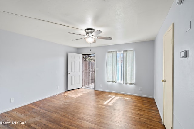 interior space with hardwood / wood-style floors and ceiling fan