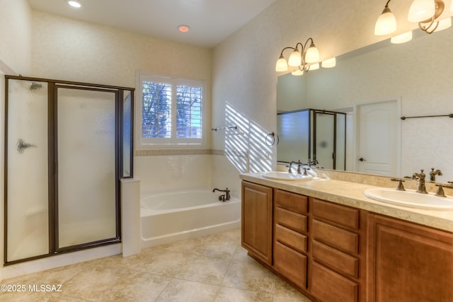 bathroom featuring independent shower and bath and vanity