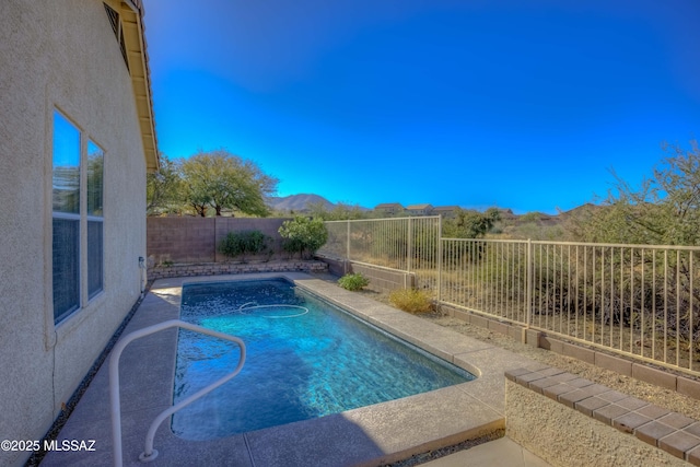 view of pool featuring a mountain view