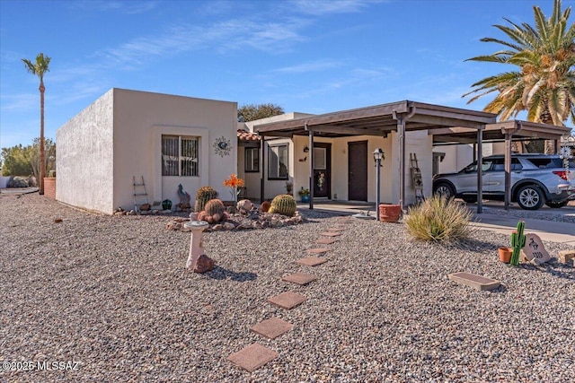 view of front of property with a carport