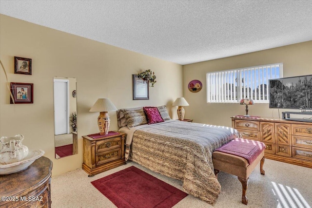 carpeted bedroom with a textured ceiling