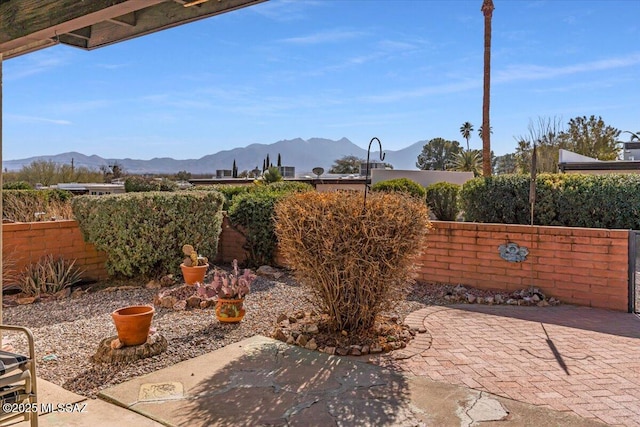 view of patio / terrace featuring a mountain view