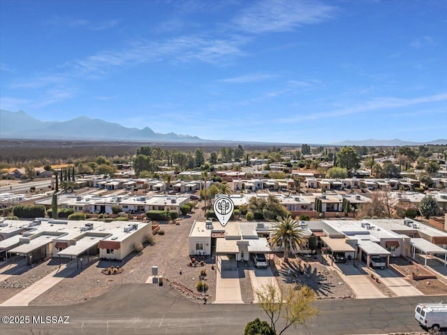 birds eye view of property featuring a mountain view