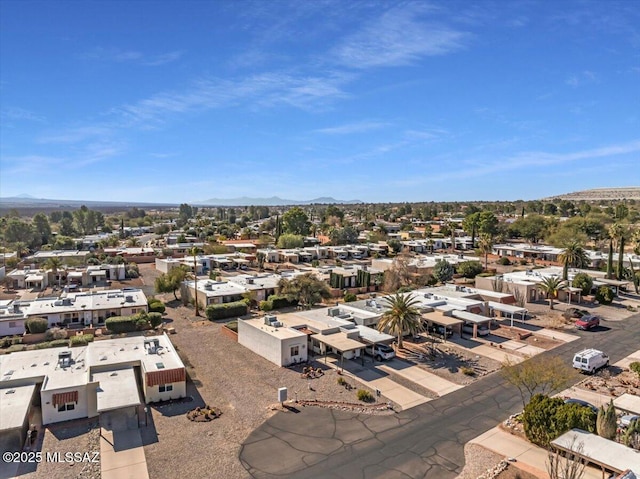 birds eye view of property featuring a mountain view