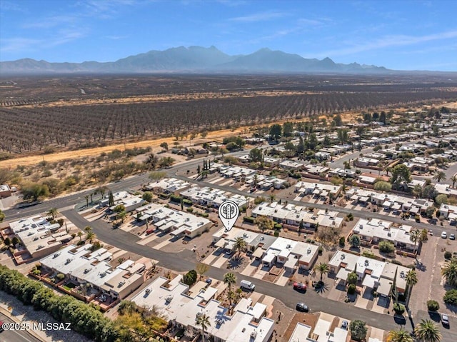 birds eye view of property featuring a mountain view