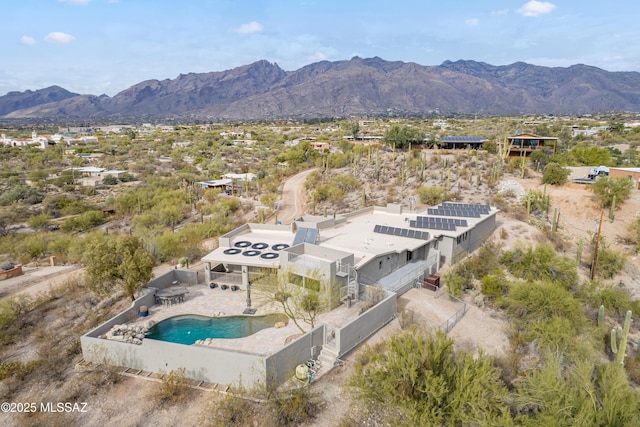 birds eye view of property with a mountain view