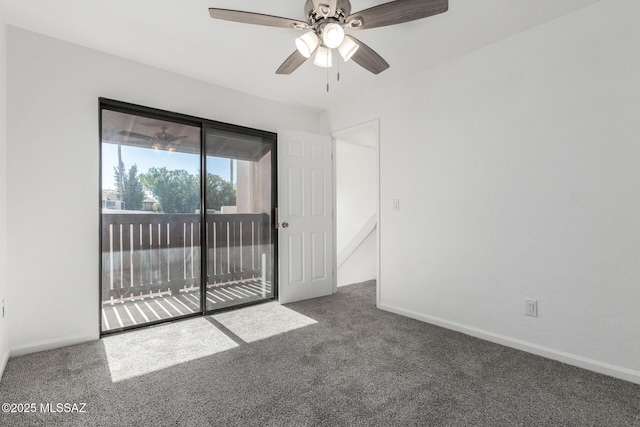 empty room with ceiling fan and dark colored carpet