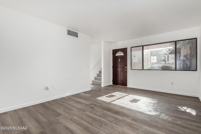 entrance foyer featuring dark hardwood / wood-style flooring