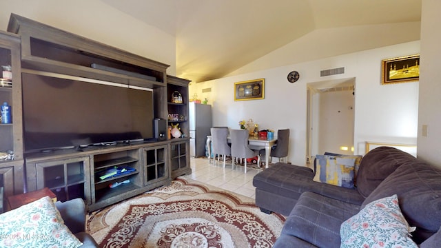 tiled living room featuring lofted ceiling