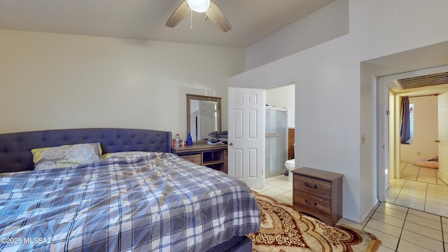 tiled bedroom featuring ceiling fan and ensuite bathroom