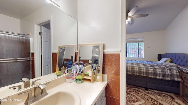 bathroom featuring ceiling fan and vanity