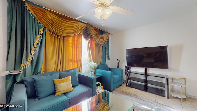 tiled living room featuring ceiling fan