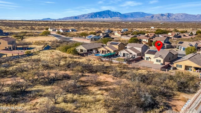 birds eye view of property featuring a mountain view