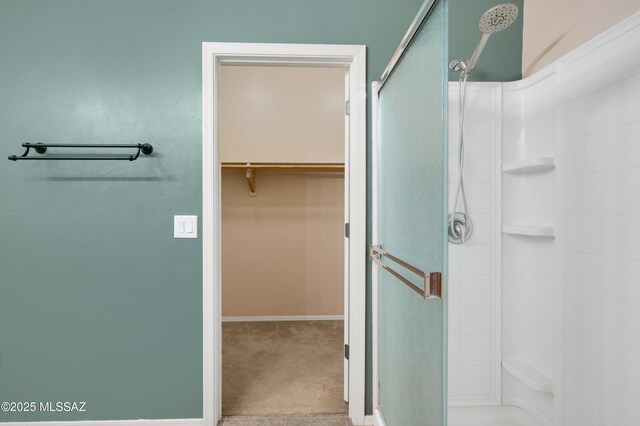 unfurnished bedroom featuring ceiling fan, a closet, and light carpet