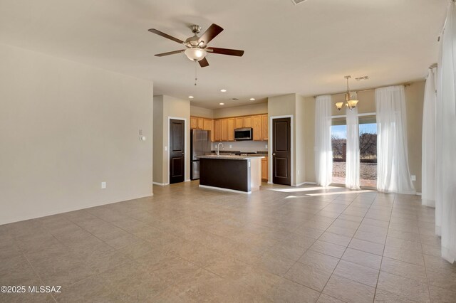 kitchen featuring light tile patterned flooring, stainless steel appliances, and sink