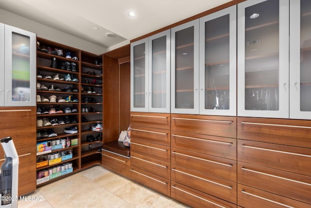 spacious closet with light tile patterned flooring