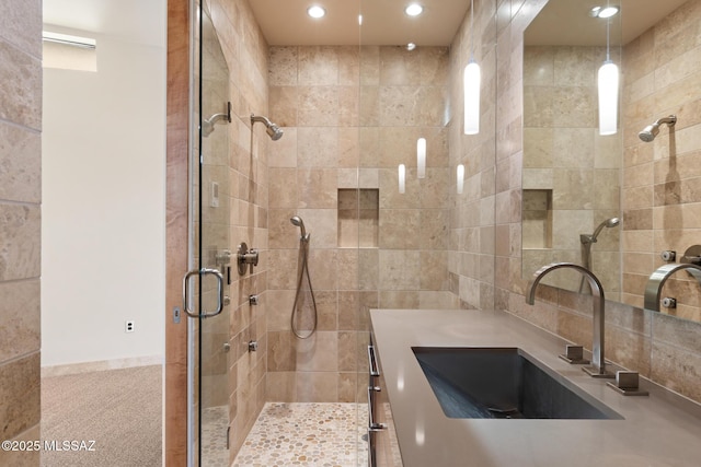 bathroom with vanity and walk in shower