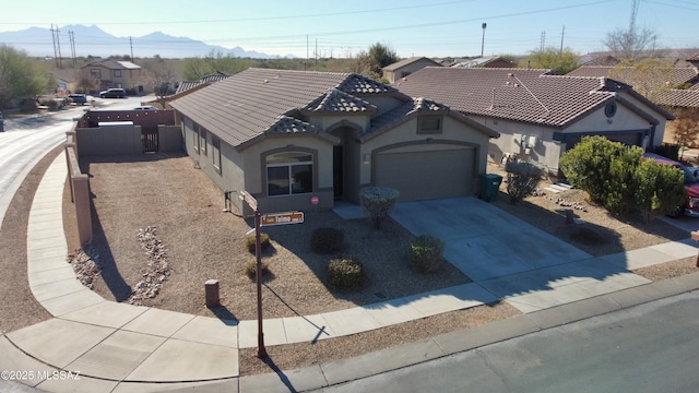 view of front of house with a mountain view and a garage