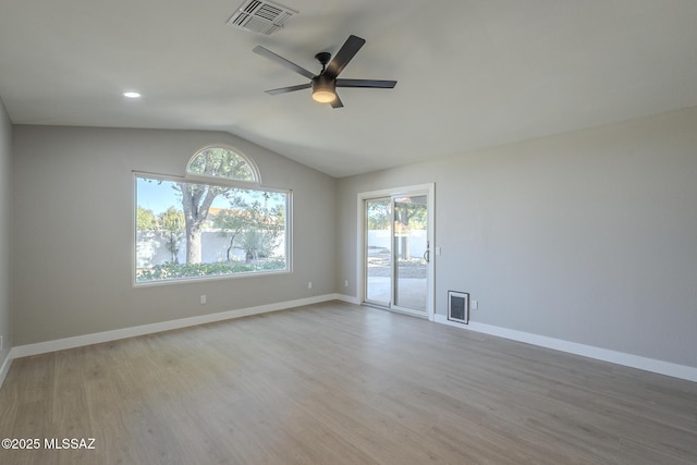 unfurnished room featuring light wood-type flooring, ceiling fan, and vaulted ceiling