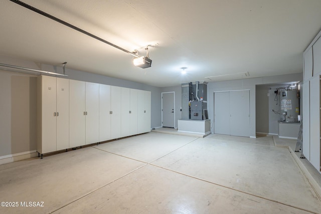 garage with a garage door opener and gas water heater