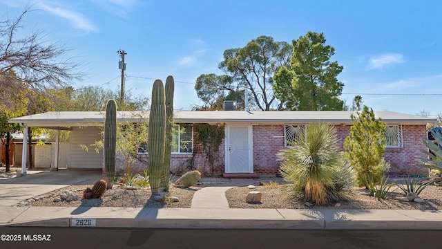 ranch-style home with a carport