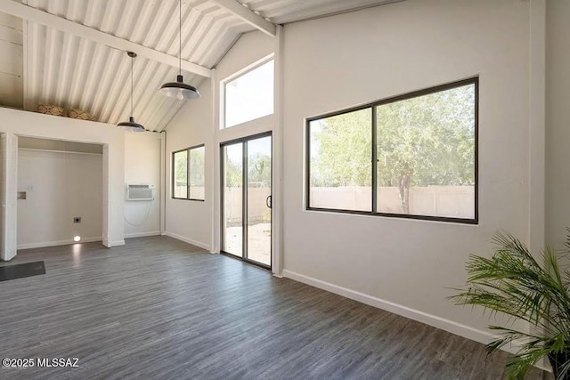 unfurnished room with dark hardwood / wood-style flooring, high vaulted ceiling, and beamed ceiling