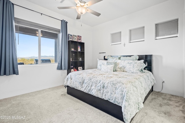 bedroom with ceiling fan and carpet