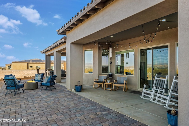 view of patio featuring an outdoor fire pit