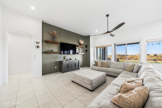 living area with light tile patterned floors, ceiling fan, and recessed lighting