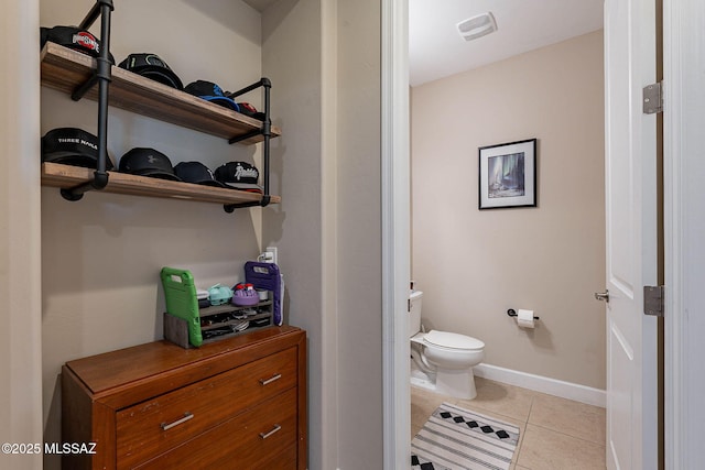 bathroom featuring tile patterned floors and toilet