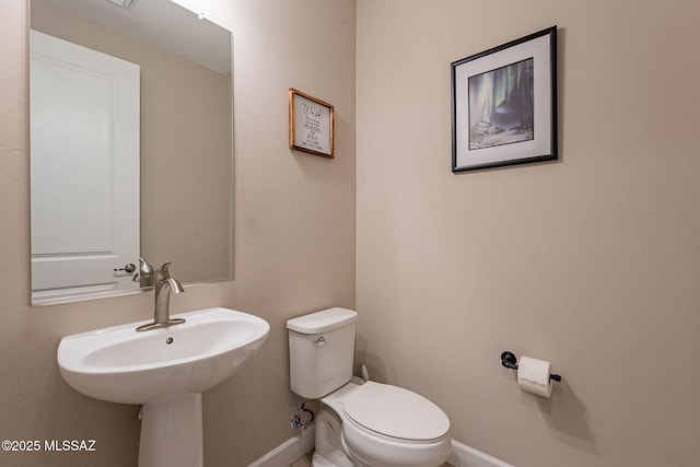 bathroom with sink and toilet