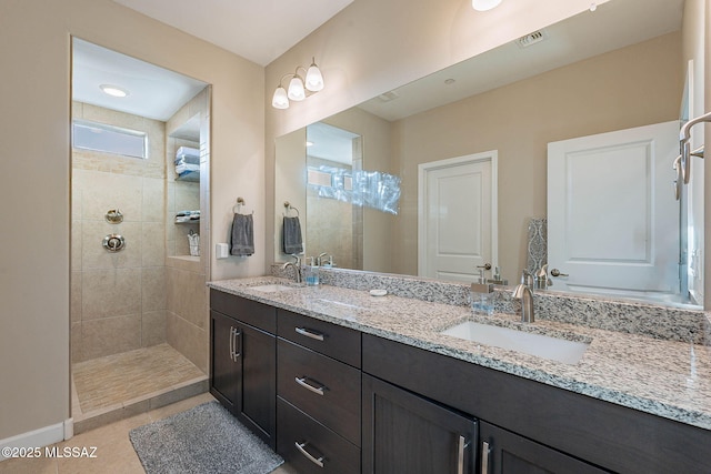 bathroom with tile patterned floors and vanity