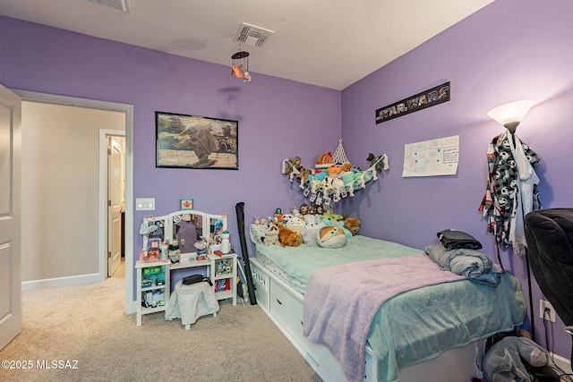 bedroom featuring light colored carpet