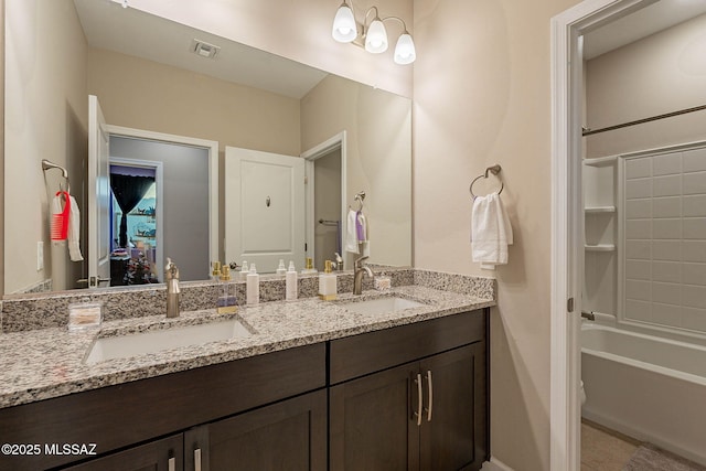 bathroom featuring vanity, tub / shower combination, and tile patterned floors