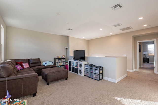 living room featuring light colored carpet